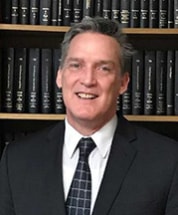 Headshot of attorney John B. Clarke